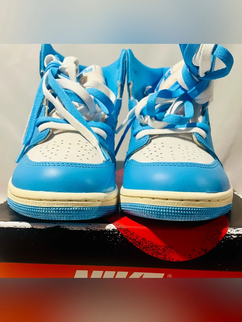 Nike Jordan Retro High-Top Sneakers in Baby Blue and White with Cream Midsole